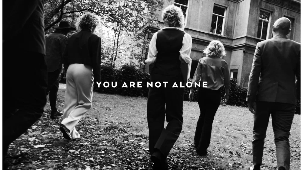 You Are Not Alone background