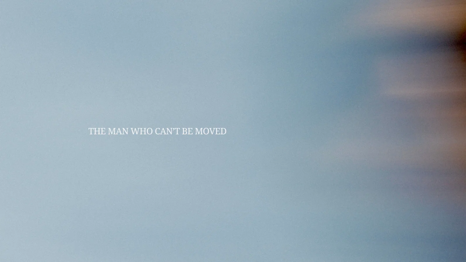The Man Who Can't Be Moved background